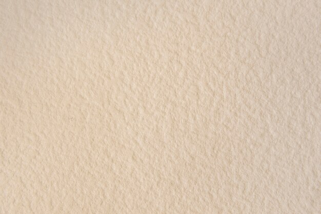Fondo de papel tapiz con textura beige en blanco