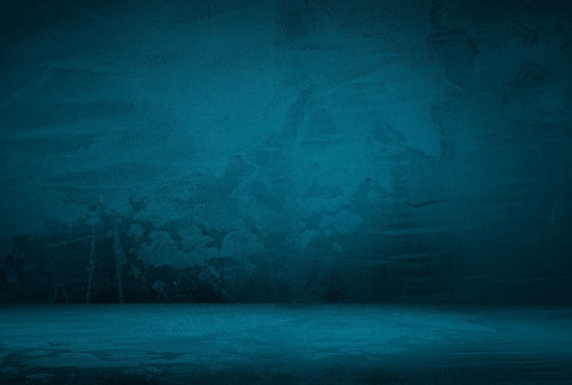 Fondo de pared de estudio de textura de hormigón azul grunge vintage con viñeta.