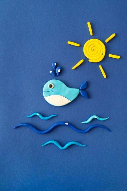 Fondo de plastilina con ballena y sol