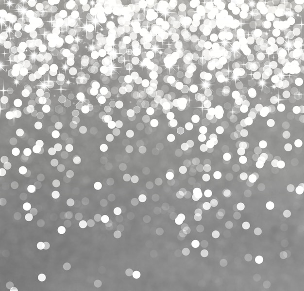 Fondo de plata reluciente de la navidad con estrellas y luces bokeh