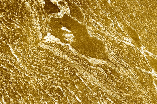 Foto gratuita fondo de superficie de muro de hormigón pintado de oro aproximadamente