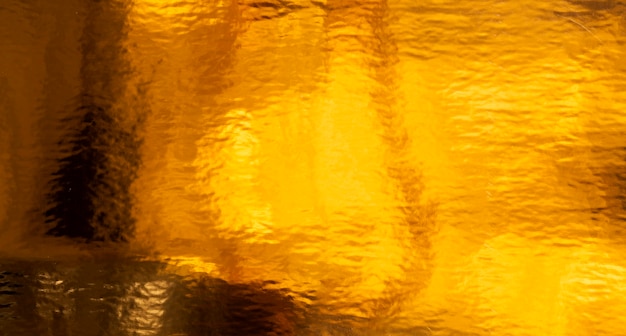 Fondo de textura dorada y efecto líquido
