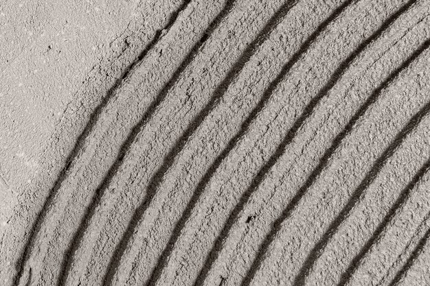 Fondo de textura de hormigón con dibujos de curva gris
