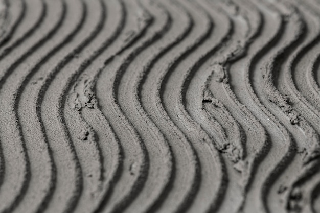 Foto gratuita fondo de textura de hormigón de patrón de onda gris