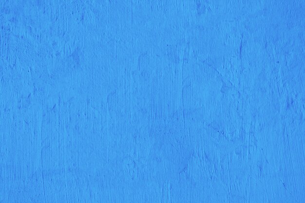 Fondo de textura de muro de hormigón azul en blanco