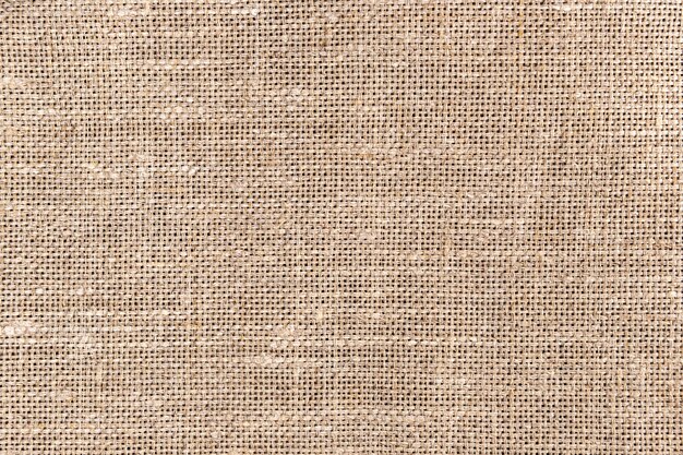 Textura y fondo de tela de saco marrón.