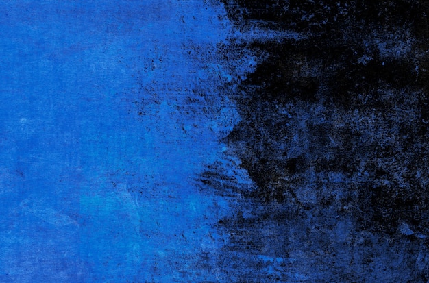 Fondo de trazos de pintura azul sobre un fondo negro