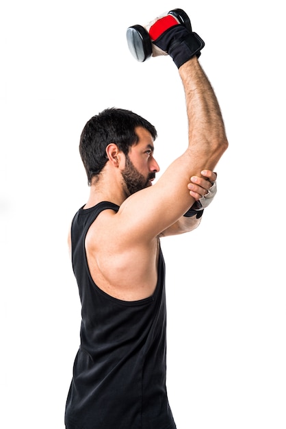 Foto gratuita gimnasio peso equipo fuerza latino