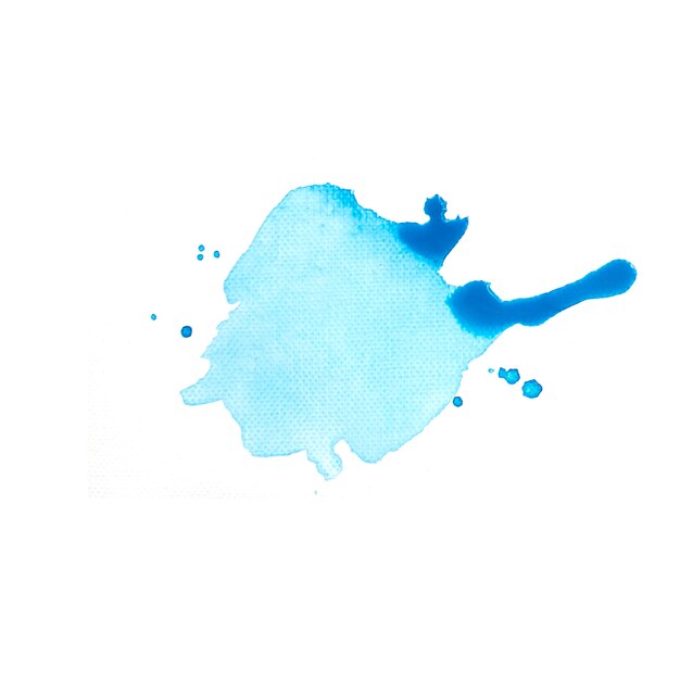 Gota azul de tinta en papel blanco