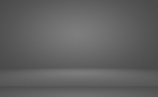 Gradiente gris y negro de la falta de definición llanura de lujo abstracto usado como pared del estudio de fondo para exhibir su p ...