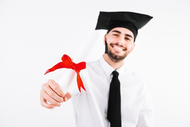 Graduating man showing diploma