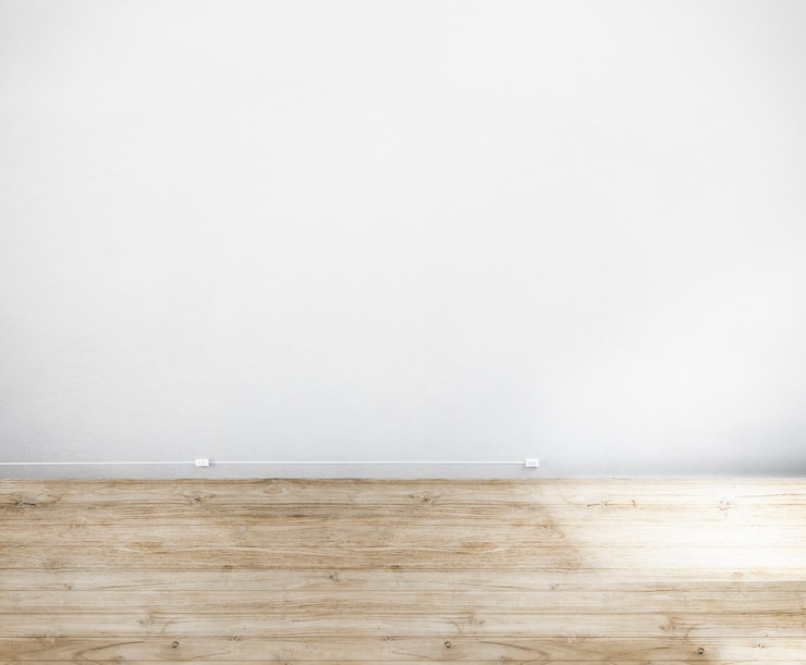 Foto gratuito habitación hecha de pared blanca y piso de madera