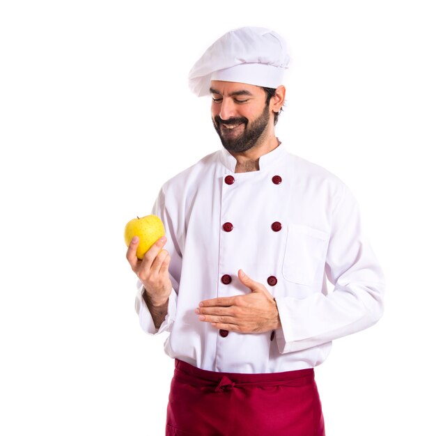 Hangry chef sosteniendo una manzana