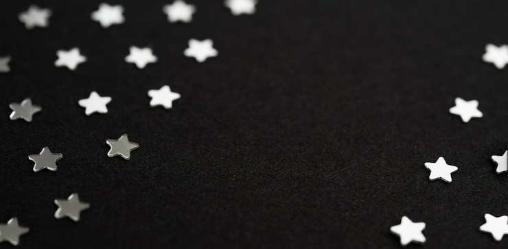 Foto gratuito hermoso fondo de estrellas plateadas