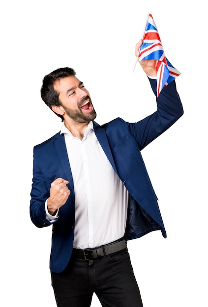 Hermoso hombre sosteniendo una bandera del Reino Unido