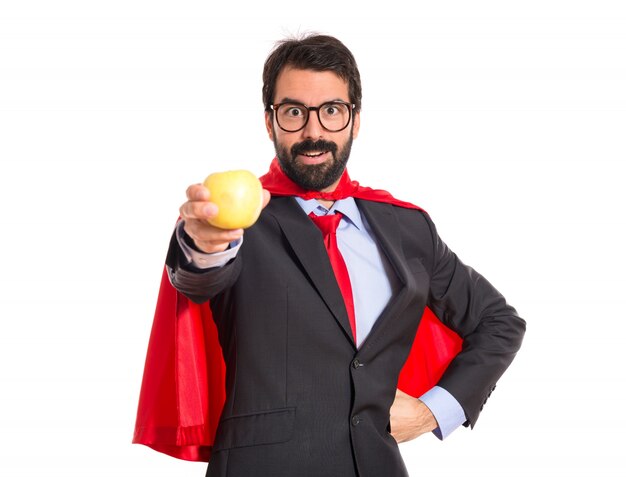 Hipster, hombre de negocios, vestido, como, superhéroe, tenencia, manzana