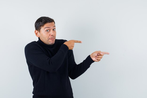 Un hombre expresivo está posando en el estudio.