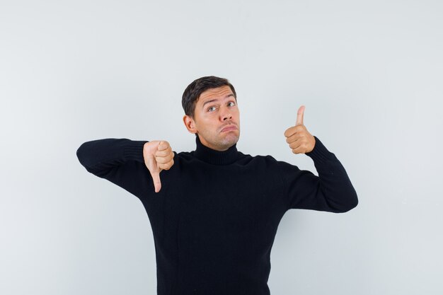 Foto gratuita un hombre expresivo está posando en el estudio.