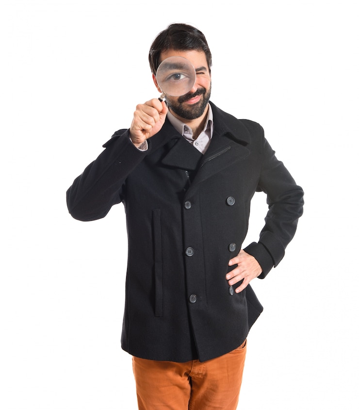Foto gratuito hombre guapo con lupa
