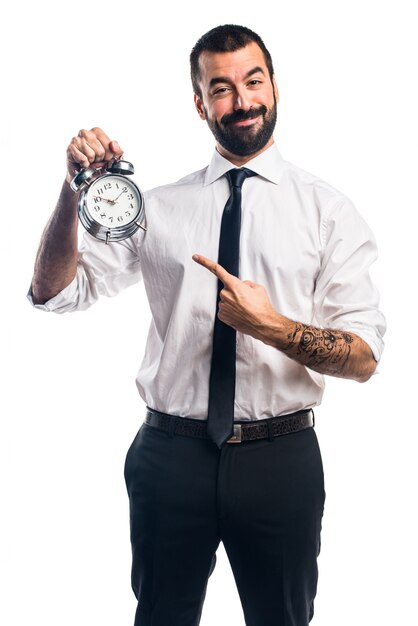 Hombre de negocios la celebración de reloj de época