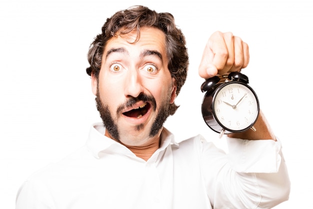 Foto gratuita hombre sujetando un reloj despertador