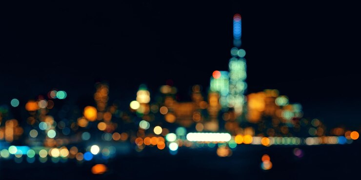 Foto gratuito horizonte del centro de la ciudad de nueva york fuera de foco bokeh panorama por la noche