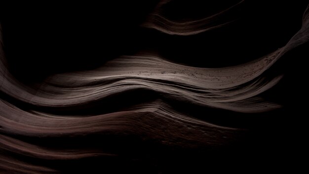 Impresionante paisaje de hermosas texturas de arena en la oscuridad en Antelope Canyon, EE.UU.