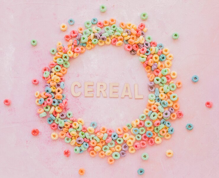 Foto gratuito inscripción de cereal en marco redondo hecho de copos de maíz.