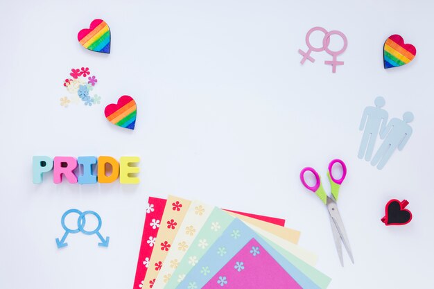 Inscripción de orgullo con parejas homosexuales iconos y corazones de arcoiris