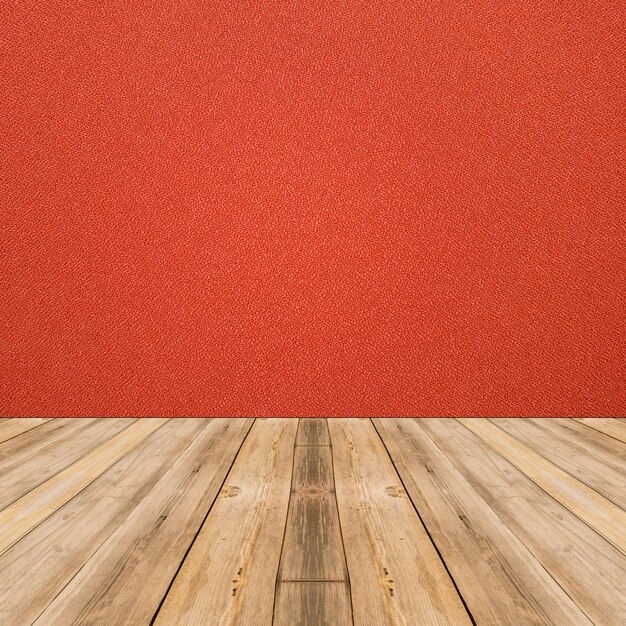 Interior de la habitación con pared de tela roja y fondo de piso de madera