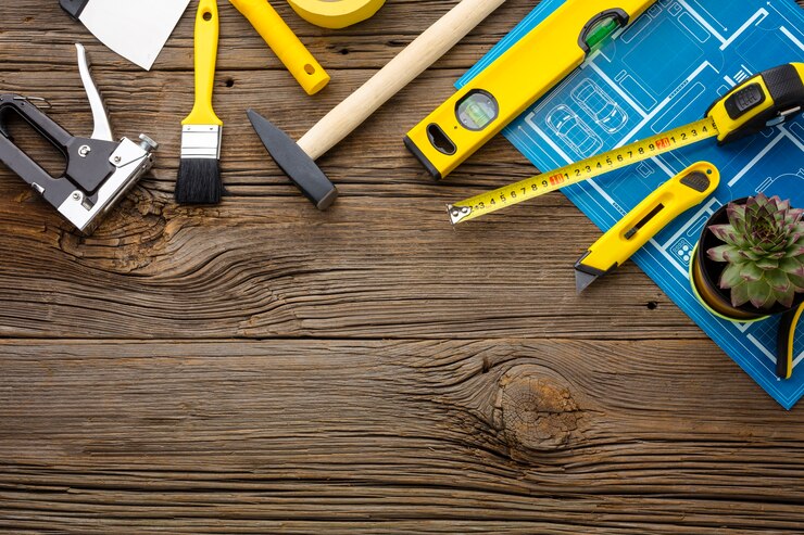Foto gratuito kit de impresión y reparación azul sobre fondo de madera