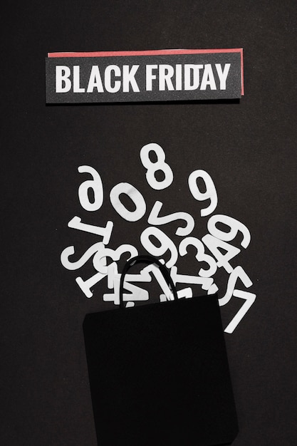 Kit de números y Black Friday firman con bolsa de compras