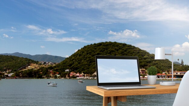 Laptop junto al mar