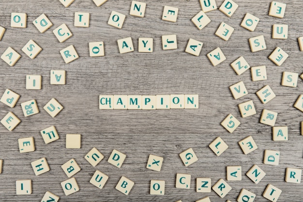 Foto gratuita letras formando la palabra champion