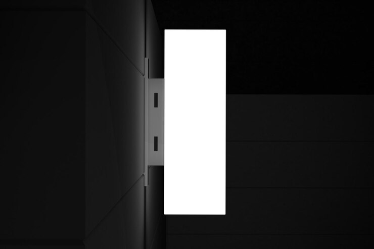 Foto gratuito un letrero en blanco colgado en una pared oscura