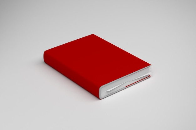 Libro de tapa roja en una superficie blanca