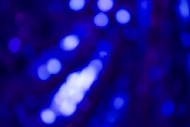 Luces de bokeh brillantes azules abstractas