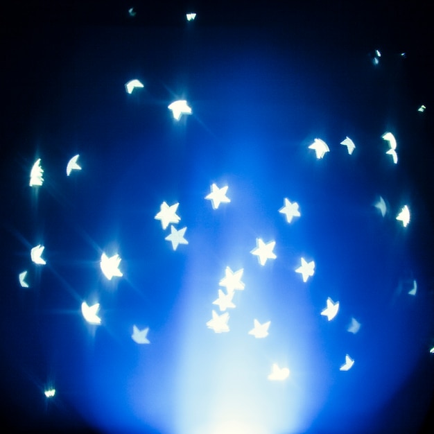 Foto gratuita luces en forma de estrella en azul