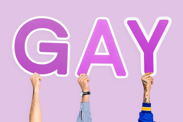 Foto gratuito manos sosteniendo la palabra gay