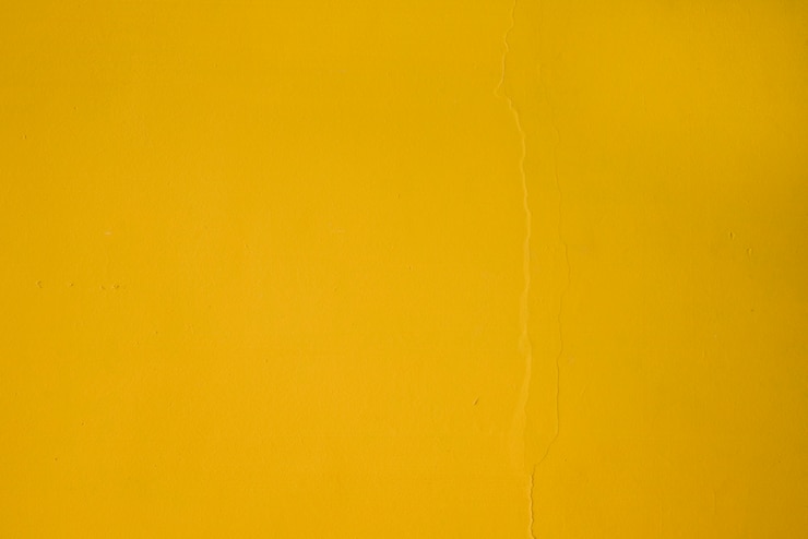 Foto gratuito marco completo de fondo de pared con textura amarilla
