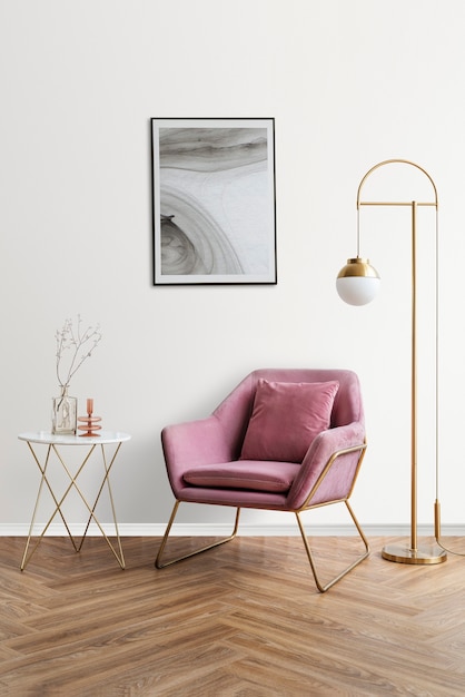 Foto gratuita marco de fotos con arte abstracto junto a un sillón de terciopelo rosa