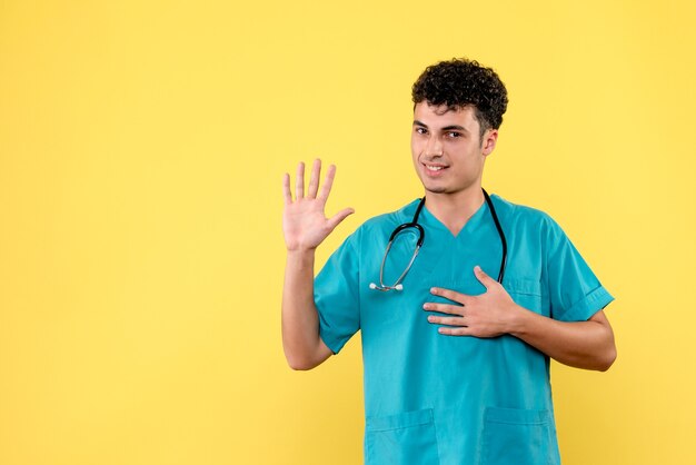 Médico de vista frontal el médico está saludando a sus pacientes