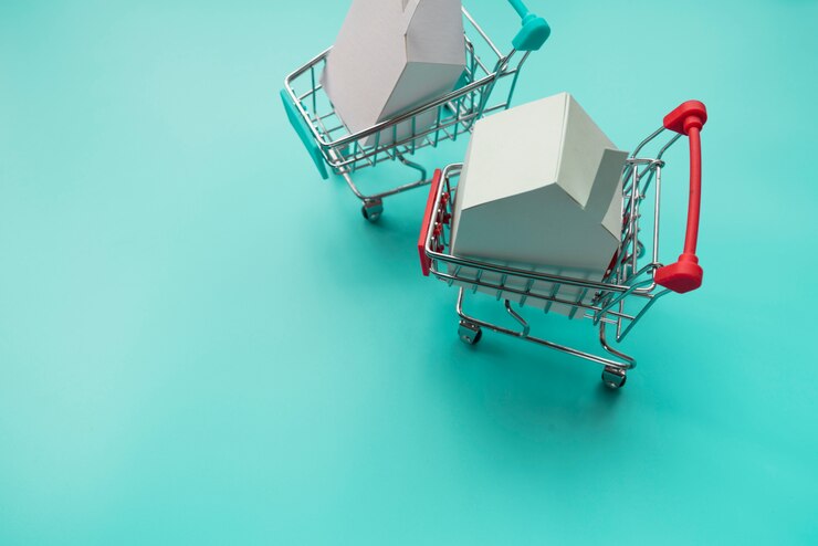 Foto gratuito miniaturas de casa en carritos de la compra