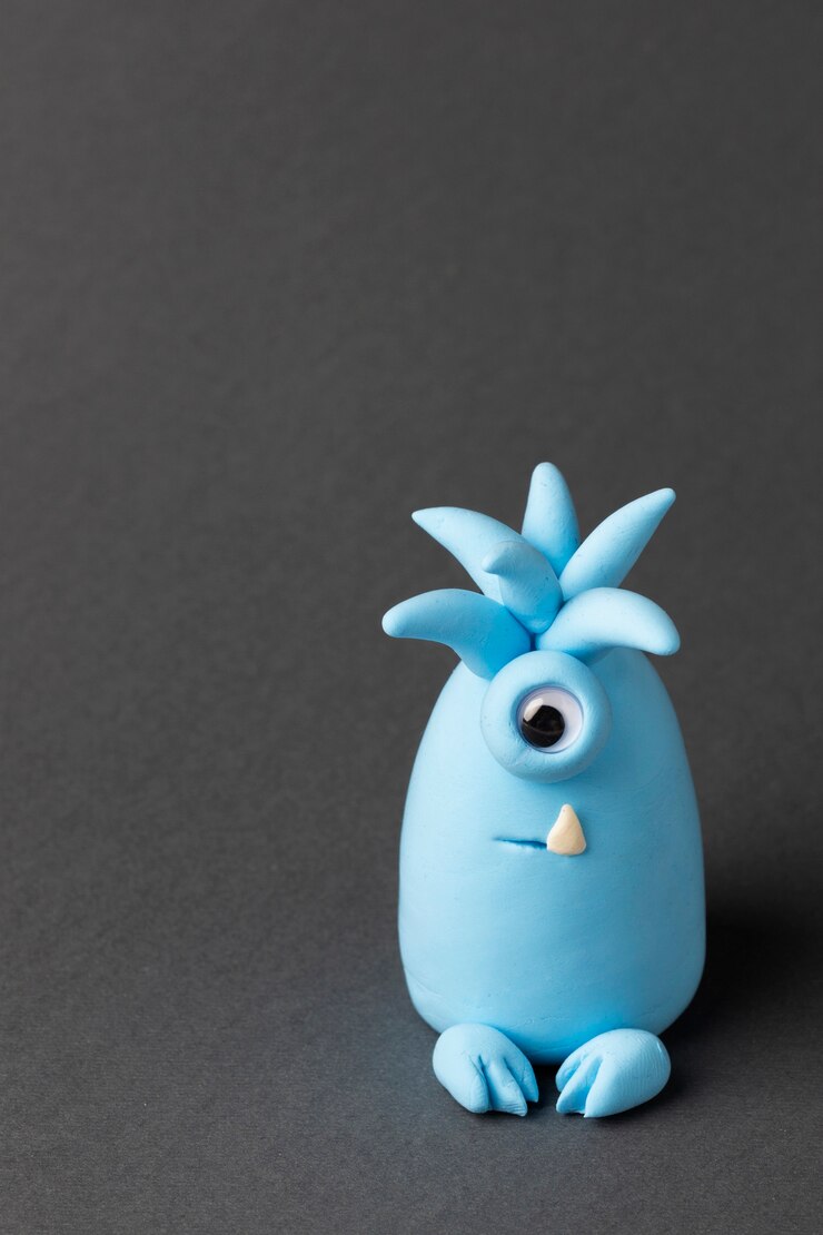Foto gratuito monstruo de plastilina azul con un ojo