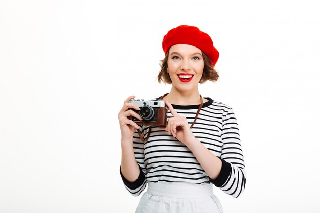 Mujer del fotógrafo aislada sobre blanco