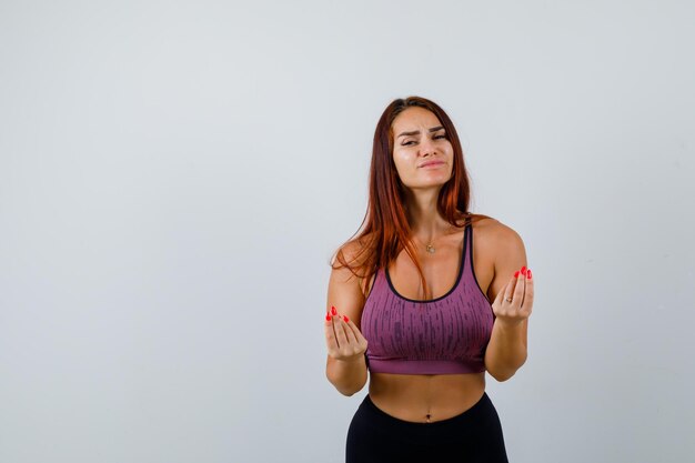 Mujer joven, con, pelo largo, llevando, ropa deportiva