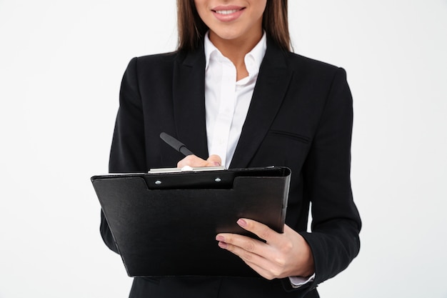 Mujer de negocios alegre celebración portapapeles.