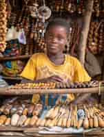 Foto gratuita niño africano en un mercado