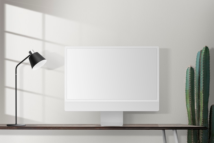 Foto gratuito pantalla de ordenador en blanco sobre un escritorio en una oficina en casa retro