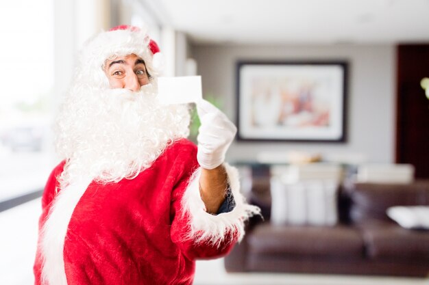 Papa noel  con un cartel pequeño